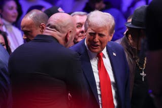 Donald Trump shakes hands with Joe Rogan at Madison Square Garden on Saturday night