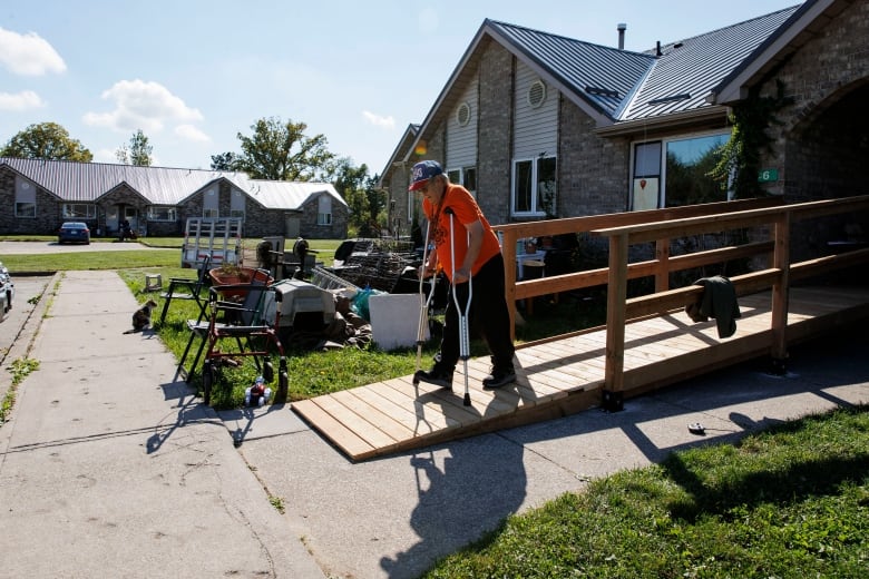 Ray Fisher leaves his house during a voluntary evacuation of the Aamjiwnaang First Nation, near Sarnia, Ont., on Oct. 1, 2024. The nearby Ineos Styrolution plant is removing benzene from a storage tank as part of the plant’s dissolution.