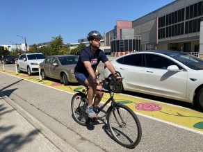 Person riding bike in bike lane