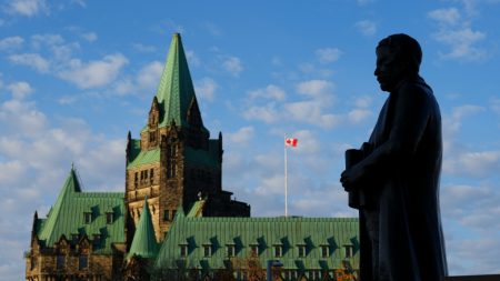 A statue of former prime minister Sir Robert Borden is backed by the Confederation Building on Parliament Hill in Ottawa, Oct. 31, 2024. THE CANADIAN PRESS/Sean Kilpatrick