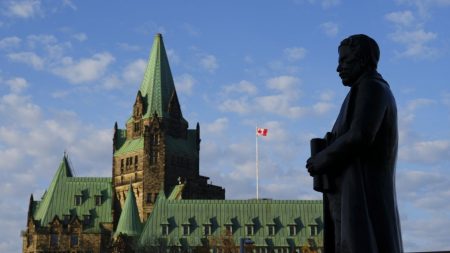 A statue of former prime minister Sir Robert Borden is backed by the Confederation Building on Parliament Hill in Ottawa on Thursday, Oct. 31, 2024. THE CANADIAN PRESS/Sean Kilpatrick