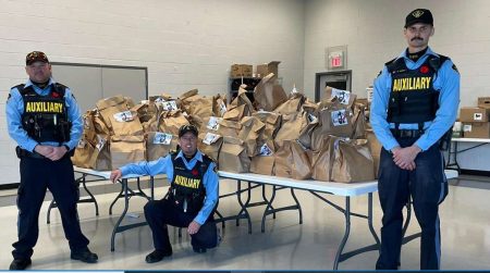 Huron OPP Auxiliary stuff a cruiser with food donations