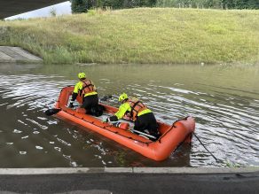 FLOOD AUGUST 18 - Fire crews in an inflatable boat on the water