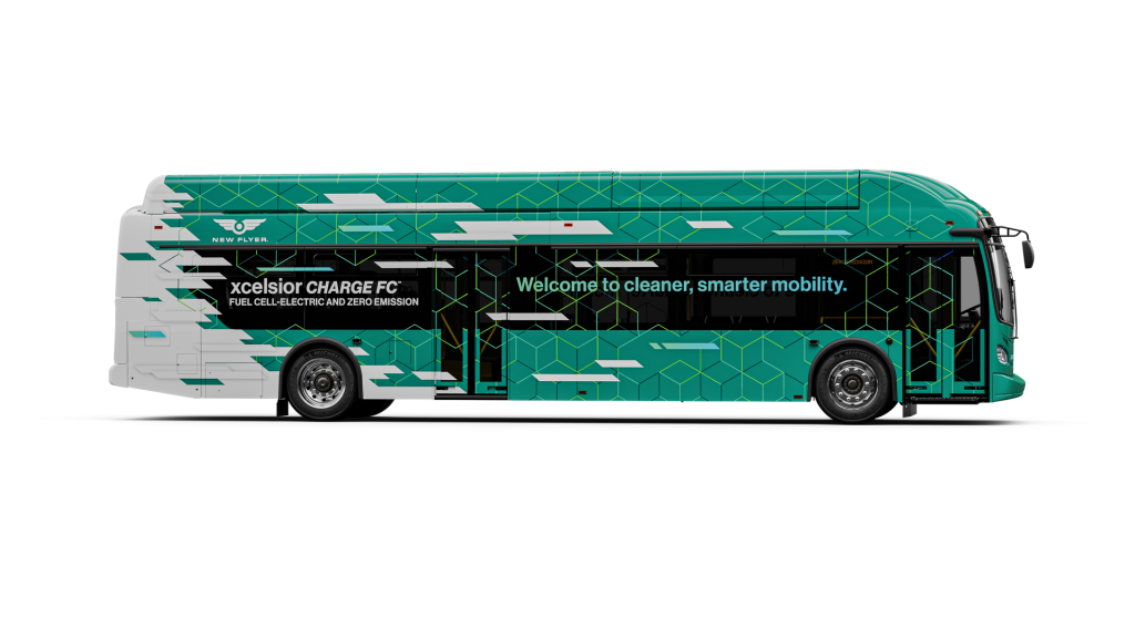 A green and white hydrogen fuel cell electric bus with "xcelsior CHARGE FC" branding and the slogan "Welcome to cleaner, smarter mobility.