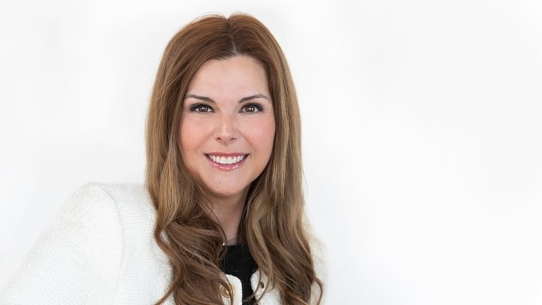 A headshot of a woman in a business suit.