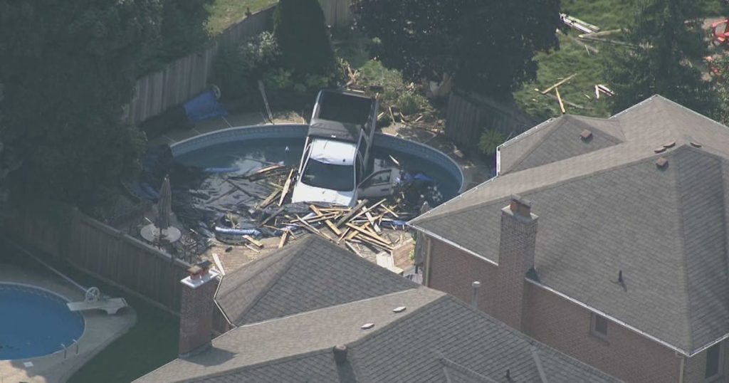 Pedestrian in hospital after truck crashes through fence in Whitby, lands in swimming pool – CP24