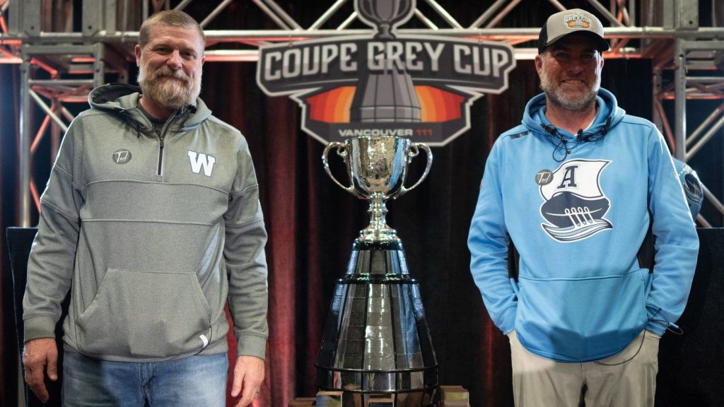 Winnipeg Blue Bombers head coach Mike O'Shea, left, and Toronto Argonauts head coach Ryan Dinwiddie, right