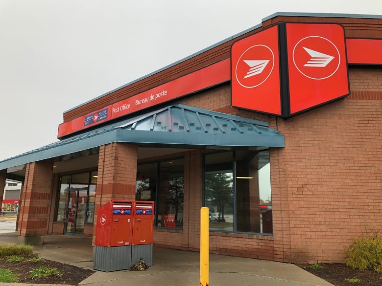 A Canada Post office with the lights off inside. 