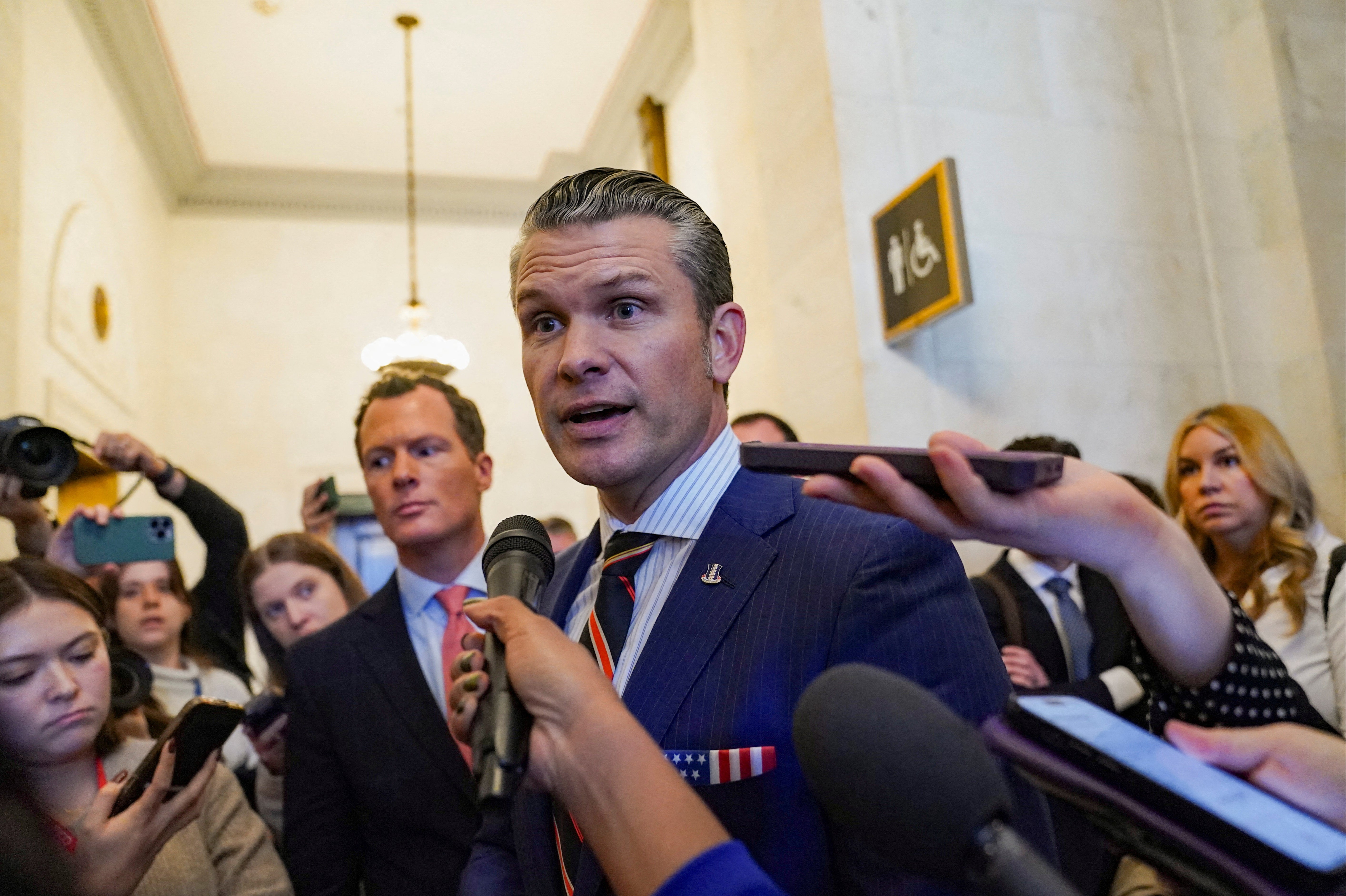 Defense secretary nominee Pete Hegseth speaks with the media as he departs a meeting on Capitol Hill in Washington, DC on November 21.