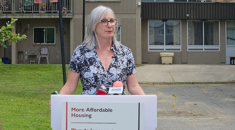 Patty Hajdu speaks in front of crowd at housing announcement.