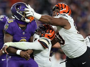 Lamar Jackson of the Baltimore Ravens is hit