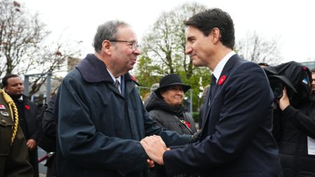 Prime Minister Justin Trudeau greets U.S. Ambassador to Canada David Cohen at a Remembrance Day ceremony at the National War Memorial in Ottawa, Nov. 11, 2024.THE CANADIAN PRESS/Sean Kilpatrick