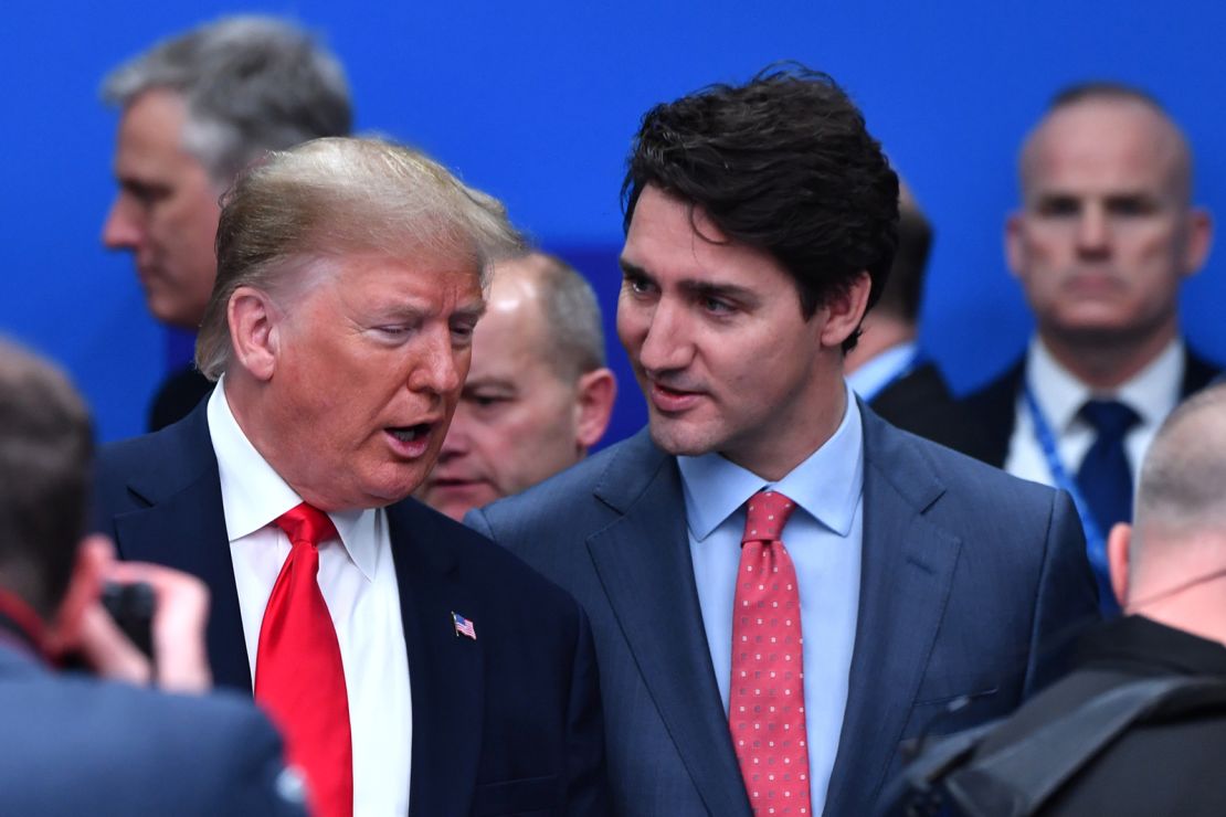 US President Donald Trump speaks with Canada's Prime Minister Justin Trudeau during the plenary session of the NATO summit in Watford, England on December 4, 2019.