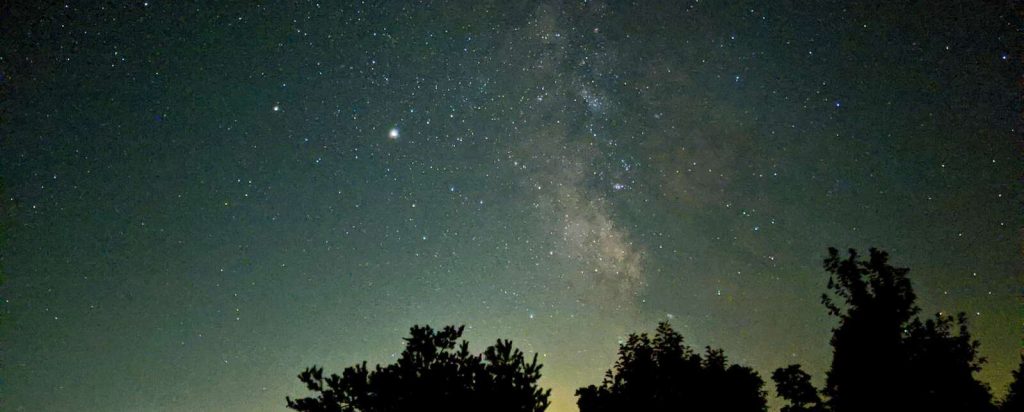 Six Planets Aligning in Planetary Parade, U of G Physicist Says silhouette of trees under starry night