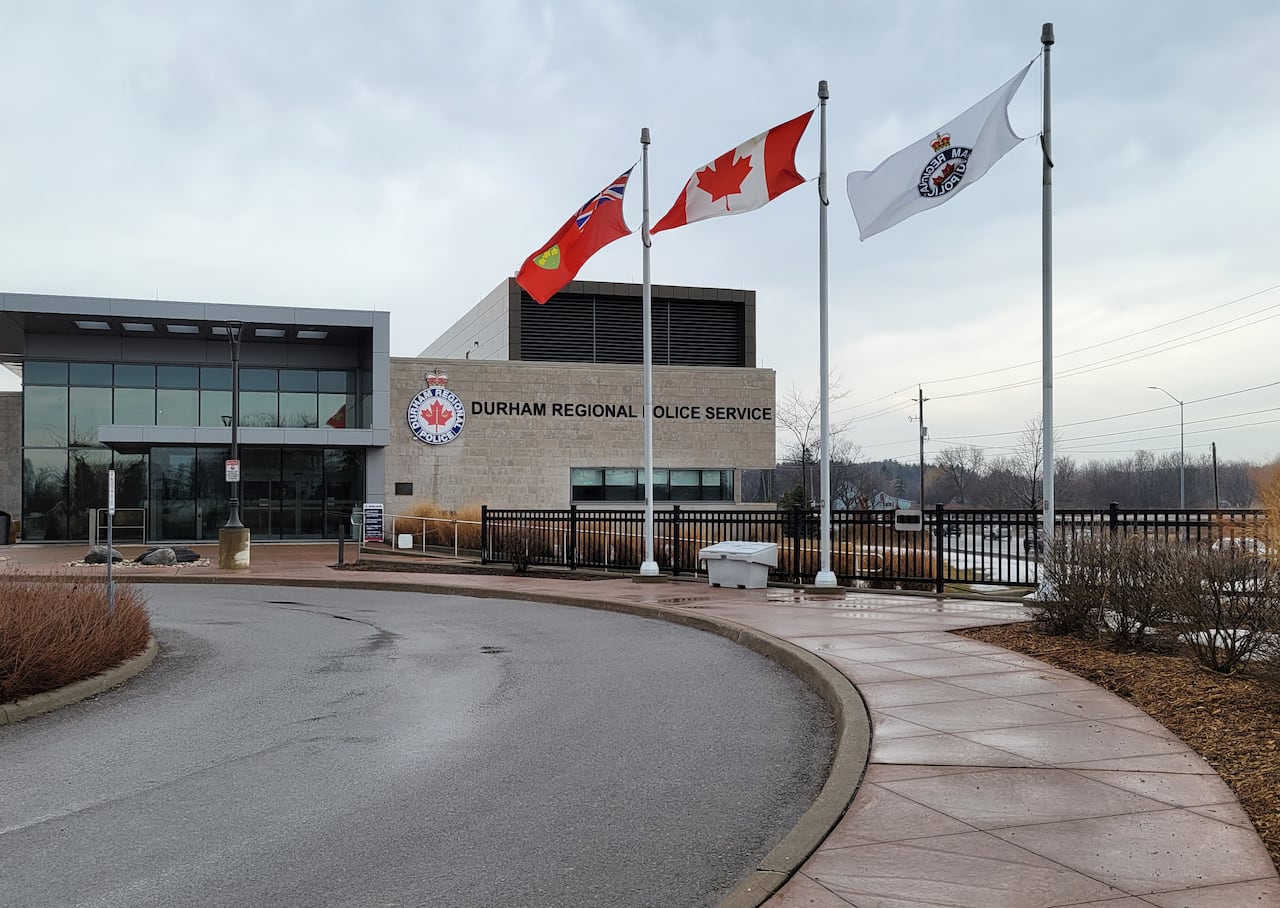 Durham police headquarters building with flags in front