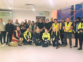 A group of people standing in a room