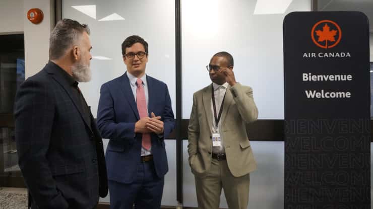 Landline Company Vice President Nick Johnson and Air Canada Manager of Regional Markets and Airlines Bernard Tavernier speaking with Sarnia Councillor Brian White. March 13, 2026. (Photo by Natalia Vega)