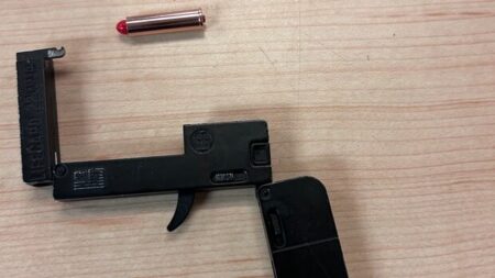 Electric Biker Caught with Compact Handgun in Kingston