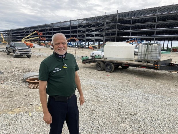 Markham Mayor Roger Agpawavisits site J uly30 ’20 where Anazonfulfillment center underconstructionlocatedsoutho f159 t h S treetbetwe en Dixie Hig hwayan d Interstate -294.