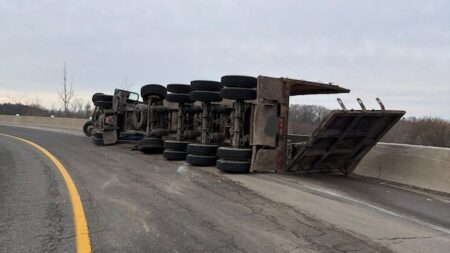 Accident on Highway 403 Causes Trailer to Flip