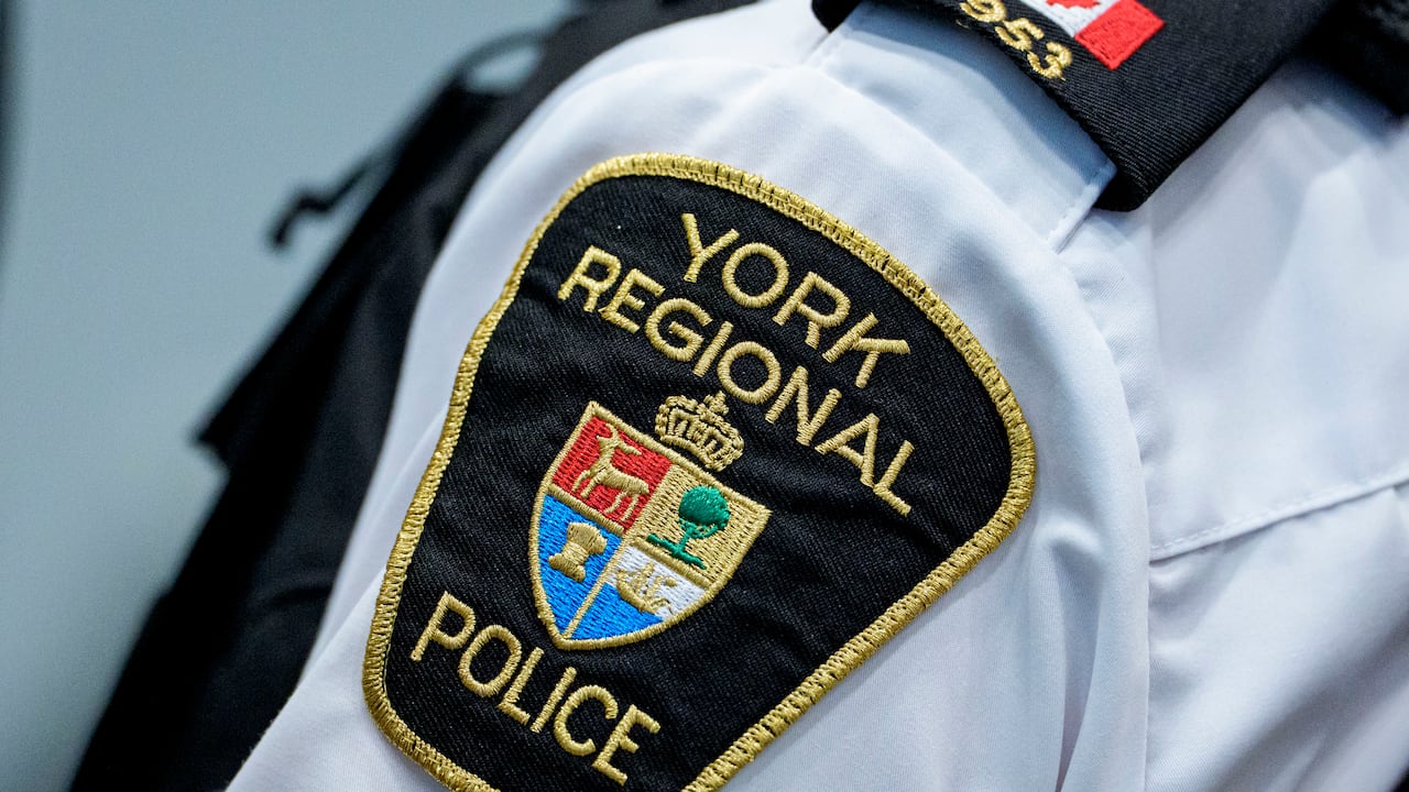 Members of the York Regional and Toronto police services announce an investigation into organized crime and corruption involving police officers, at a press conference in Aurora, Ont., on Feb. 5, 2026.