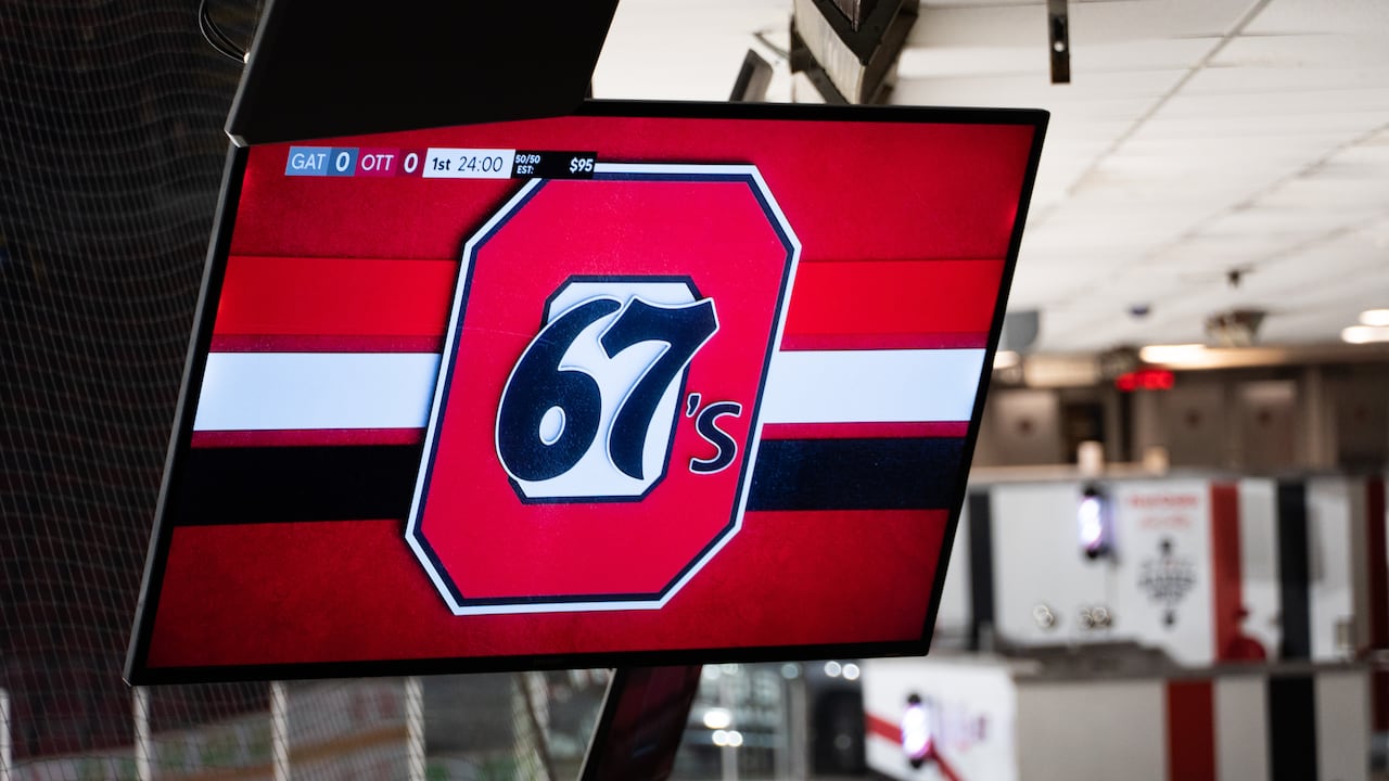 A hockey team logo on a screen.