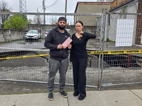 Couple holding parking ticket