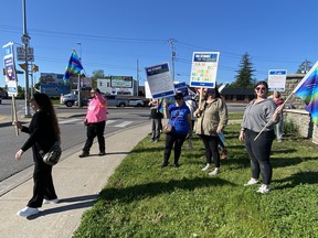 Striking workers with picket signs