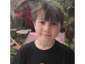 An 8-year-old boy smiling