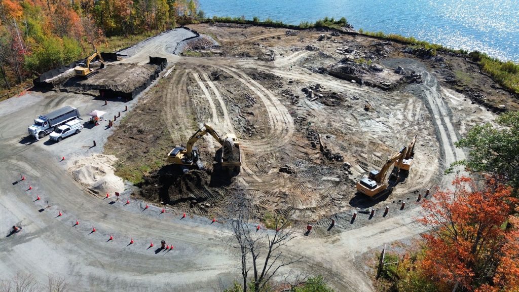 Near the shore of Lake Nipissing, trucks and machines are used to excavate niobium gravel.