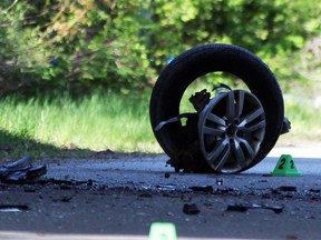 A damaged wheel sits on the ground