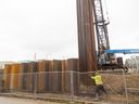  Crews install750 steel sheets around perimeter Greenwaywastewatertreatmentplant London Together they'll tie existing berms create island case flooding nearby Thames River Photo taken Dec.12 ,2024 Mike Hensen/The London Free Press