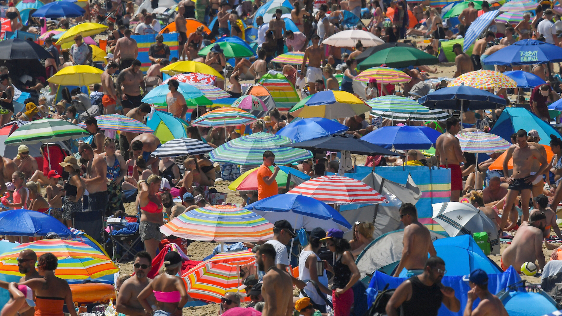 Click to play video : ' Coronavirus : Thousands crowd U. K. beaches , ignoring health advice '