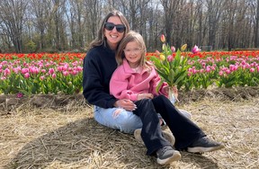 Folks from across Ontario have flocked to Norfolk County to enjoy picking tulips at the Berkelbloem Tulip Festival just east of Delhi. Pictured are Jenna and Ady Atkins of London. The festival will run until late May.