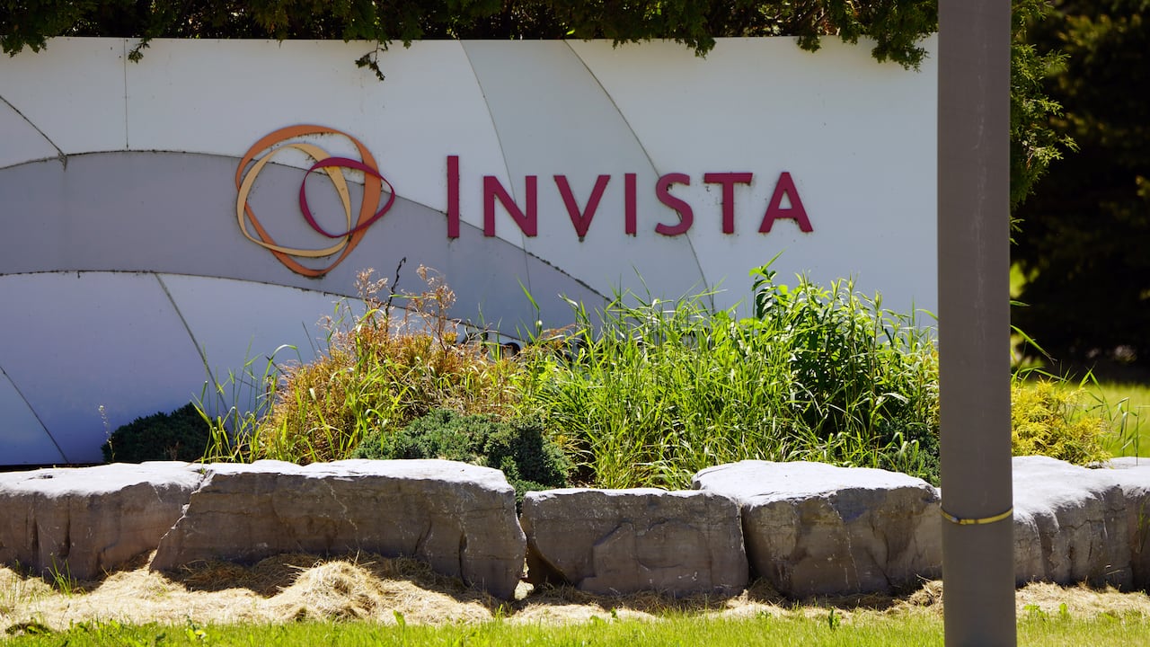 A close-up photo of a sign with the word INVISTA on it.