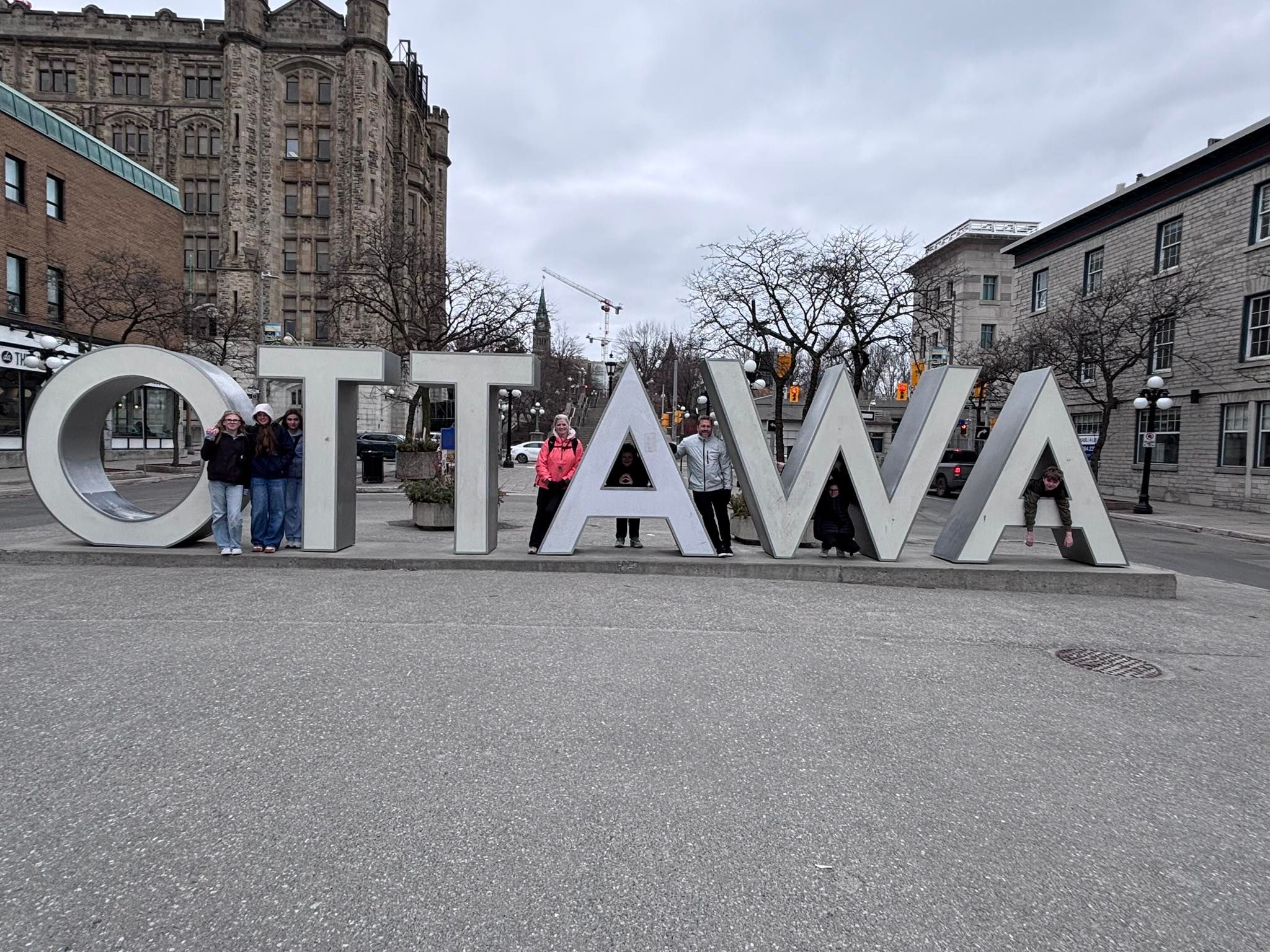 Students gather at the Ottawa sign during a stop in the nation’s capital where they explored Canada’s government and national landmarks. Submitted Photo/Mark Sokolowski