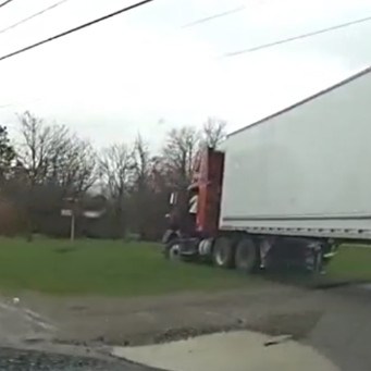 Trucker Faces Charges After Getting Stuck in Yard Trucker Faces Charges After Getting Stuck in Yard