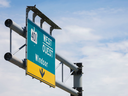 A bird sits atop sign on Wellington road for On ramp To High way401 West bound In London On Wednesday June24 ,2026 Geoff Robins/The London Free Press