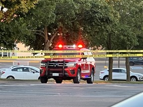 A Kingston Fire and Rescue vehicle sits behind a taped off intersection of Midland Avenue and Princess Street after a collision knocked out hydro services to thousands of people in Kingston's west end Friday night. (Bill Hall/The Kingston Whig-Standard/Postmedia Network)