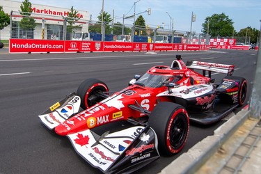 An Indy Car in front of a Honda dealership at the 2026 Honda Dealers Indy event in Markham, Ontario