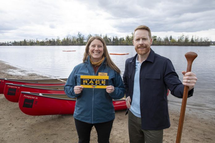 Carolyn Hyslop serves as executive director at The Canadian Canoe Museum holding a clue for participants alongside host Jon Montgomery at Beavermead Park beach area within Peterborough. Airing August 11th on CTV with availability to stream via Crave next day; this fifth installment features multiple destinations throughout both Peterborough along with Kawarthas such as mentioned museum plus Ontario Turtle Conservation Centre located nearby Bobcaygeon plus Lock number thirty-one situated along Trent-Severn Waterway found within Buckhorn region itself.(Photo: Bell Media)