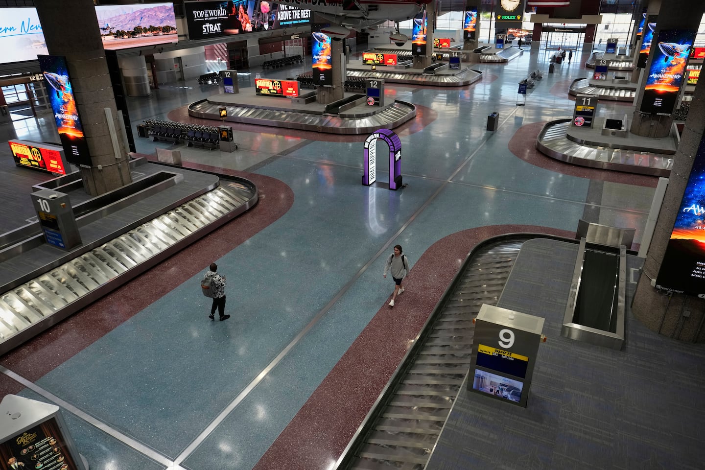 People walked through Harry Reid International Airport in Las Vegas in August.