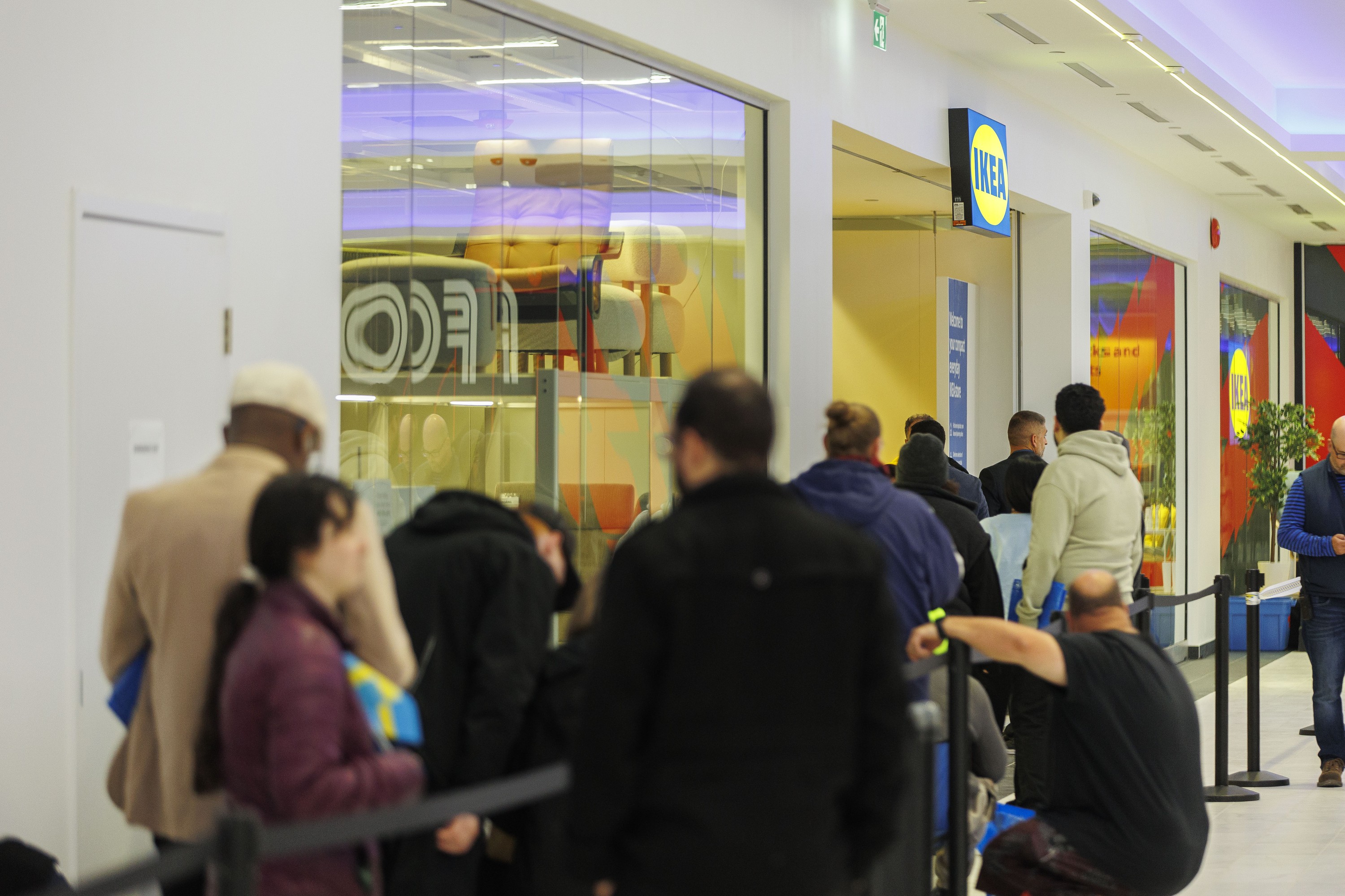 Customers wait in line for the grand opening