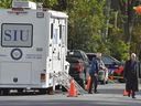 Officials with the Special Investigations Unit are seen exiting an SIU vehicle on Victoria Ave. on the morning of Monday, Sept 21, not far from the Sons of Jacob Synagogue in Belleville. Investigators are looking into a gunfire exchange on Sunday evening involving a Belleville Police officer and a man outside the synagogue. Both men were critically injured and transported to Kingston General Hospital.